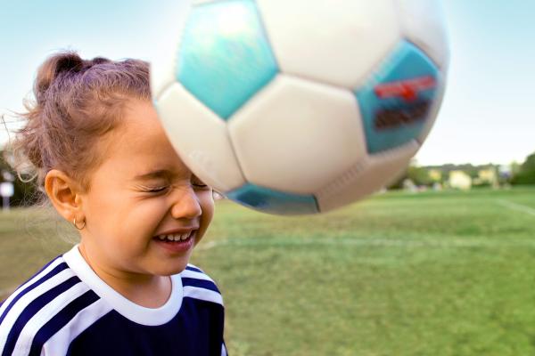 Little Girl Bouncing Soccer Ball